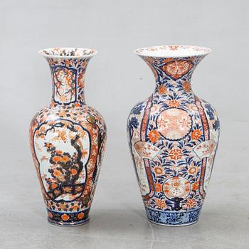 A set of two Japanese porcelain Imari floor urns.