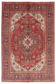 A Tabriz carpet, c. 300 x 200 cm.