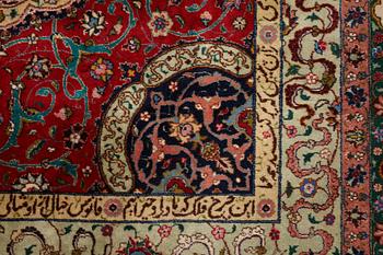 A carpet, semi-antique Tabriz, signed ca 335,5 x 256,5 - 261,5 cm.