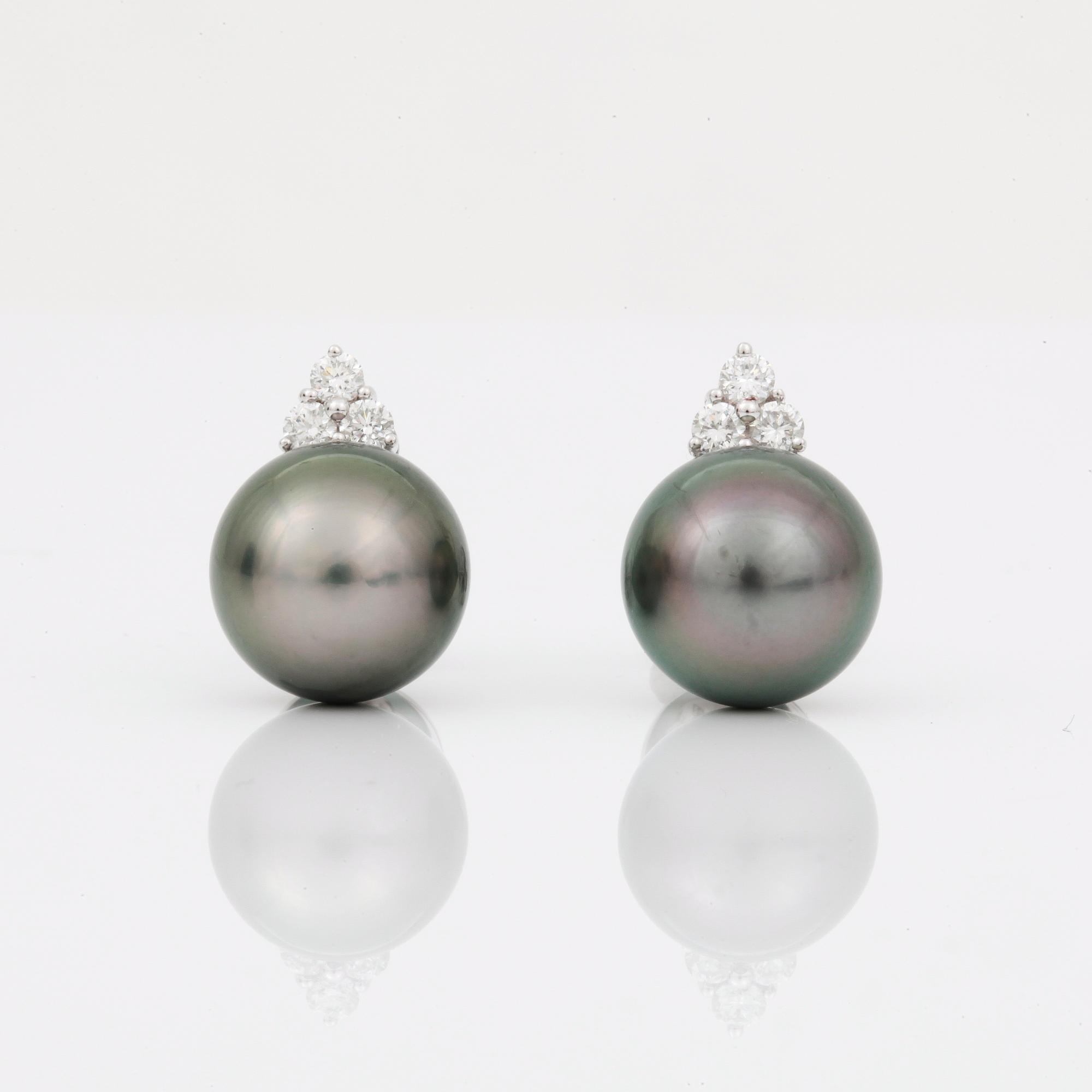 EARRINGS, studs with black cultivated pearls circa 11mm and diamonds circa 0.30cts.