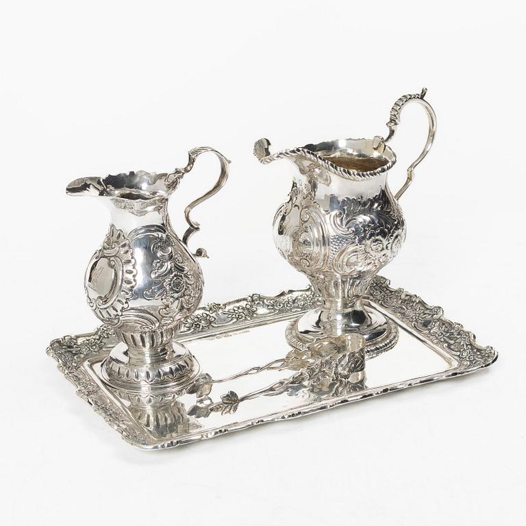 Two creamers, a tray, and a sugar tongs, silver, Rococo and Rococo style, 18th-19th century.