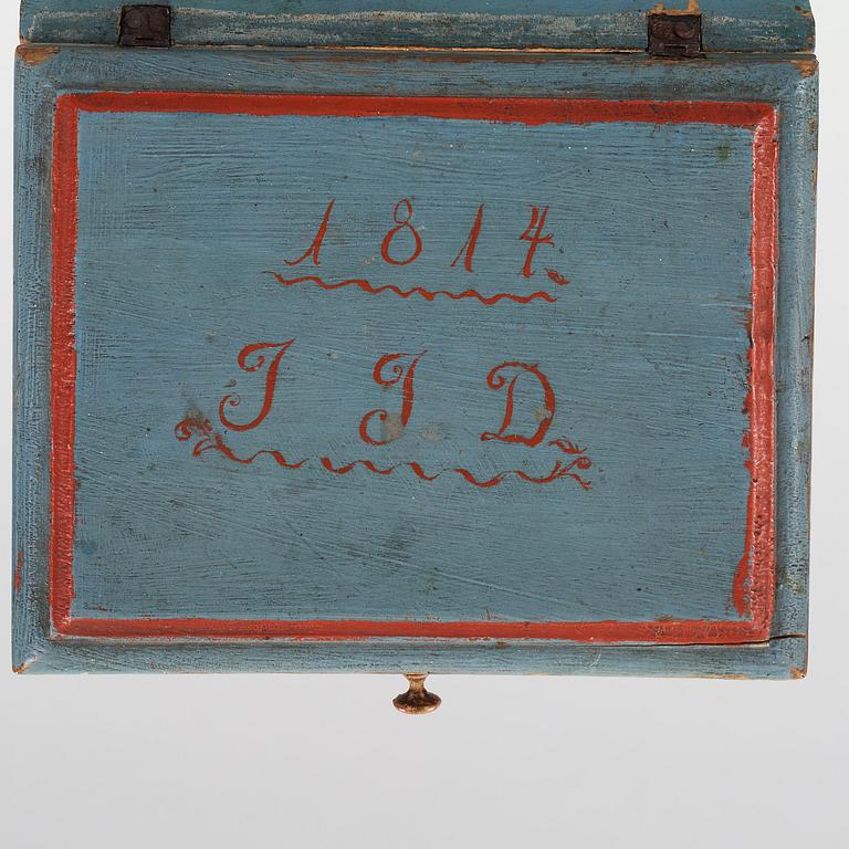 a wooden box marked JJD 1814.