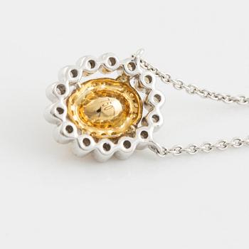Oval cut yellow diamond and brilliant cut diamond necklace.