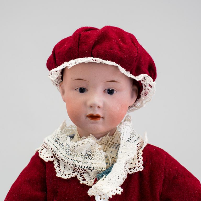 A bisque headed character boy doll, Germany, 1910s.