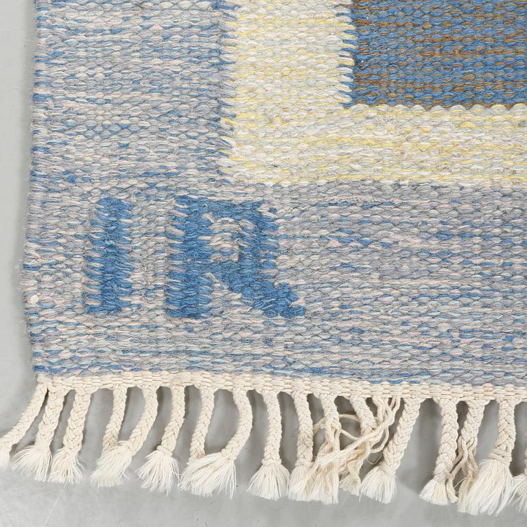 A flat weave carpet designed by Ida Rydelius from the second half of the 20th century.