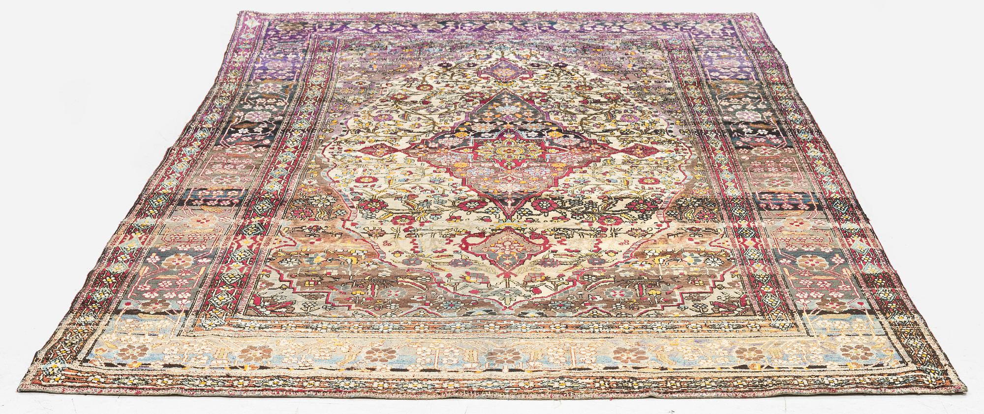 An antique silk Kashan rug, Central Persia, c. 207 x 131 cm.