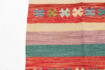 A kilim rug, ca 298 x 208 cm.