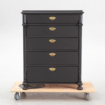 A chest of drawers, circa 1900.