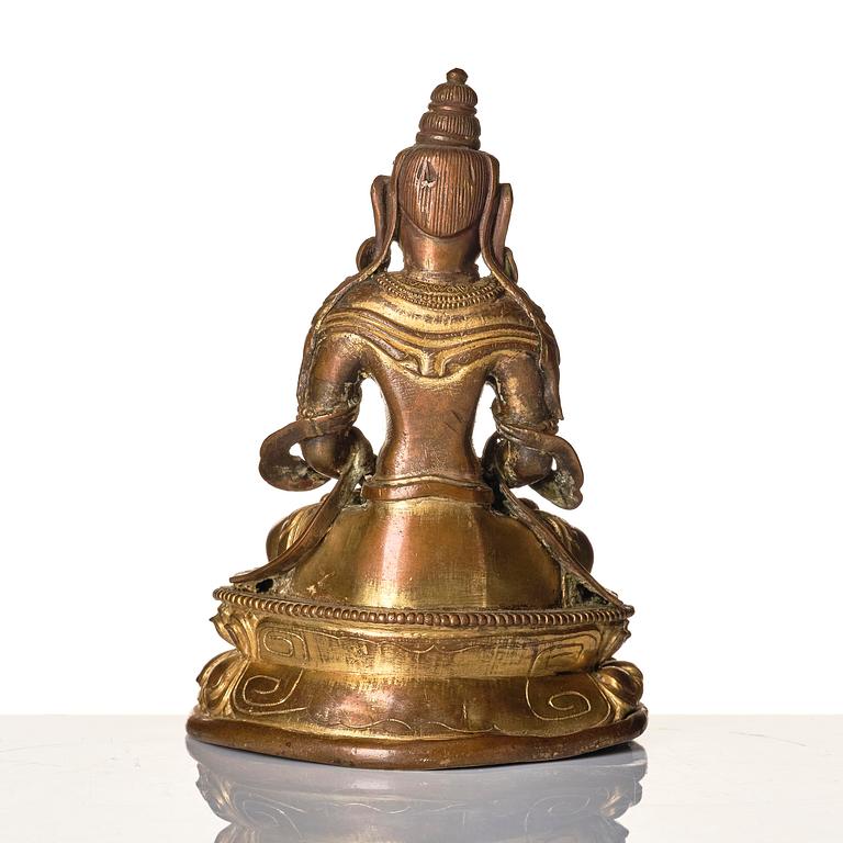 A gilt copper alloy figure of Amitayus, Tibeto-Chinese/Mongolia, 18th century.
