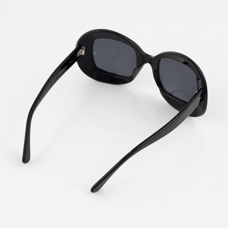 Oliver Goldsmith, a pair of black "Uuksu" sunglasses.