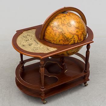 A globe shaped drinks cabinet, circa 2000.