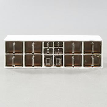 A spice rack from around the middle of the 20th century.