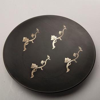 A Swedish 20th century set of 14 plates in bakelite and silver mark of T Wendt Helsingborg 1945.