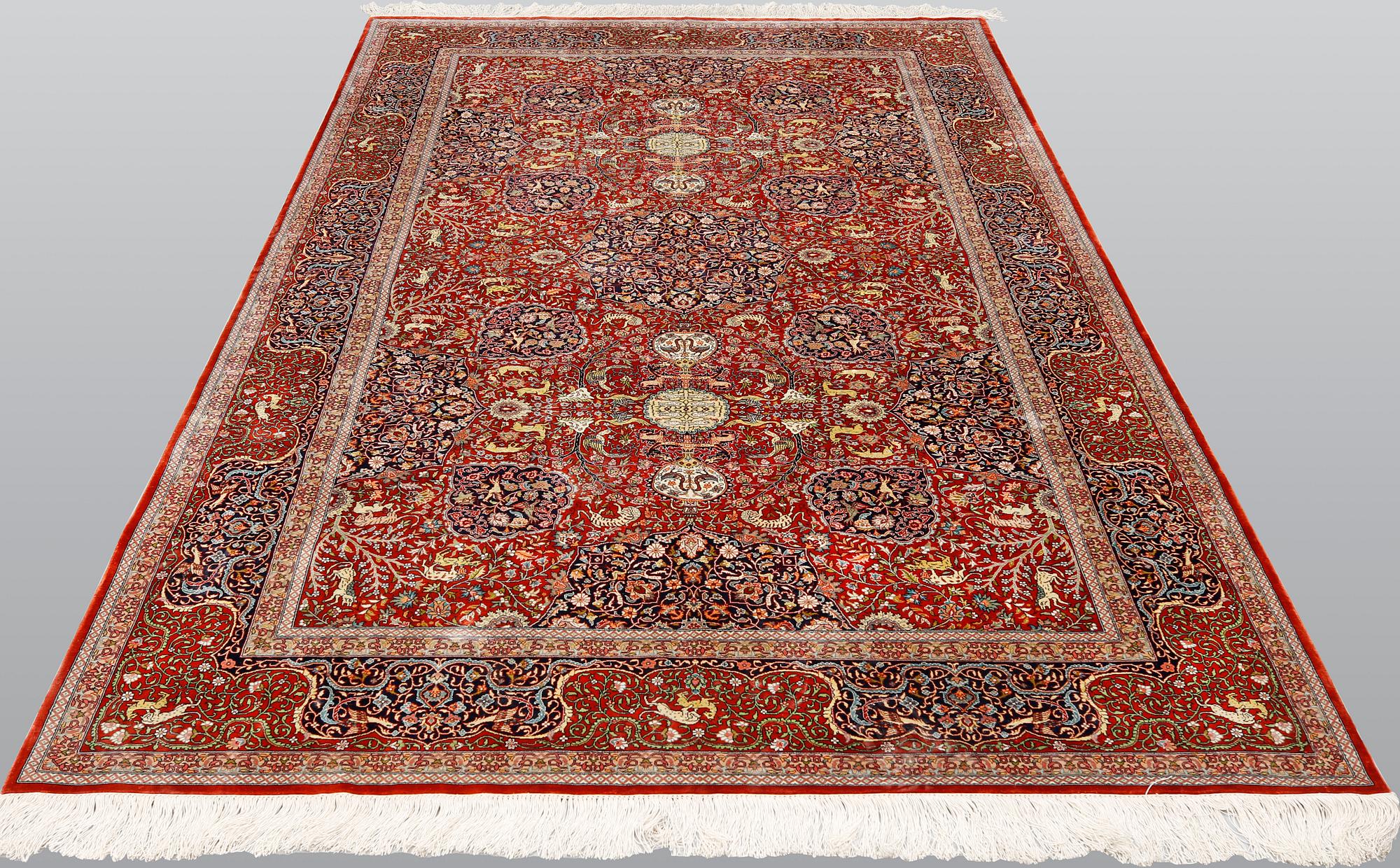A pictoral orietal silk rug, 246 x 153 cm.