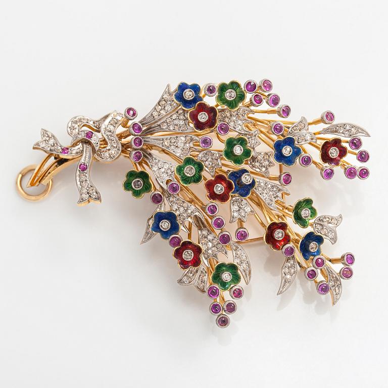 A 17K gold brooch/pendant with rose-cut diamonds, cabochon-cut rubies and enamel.
