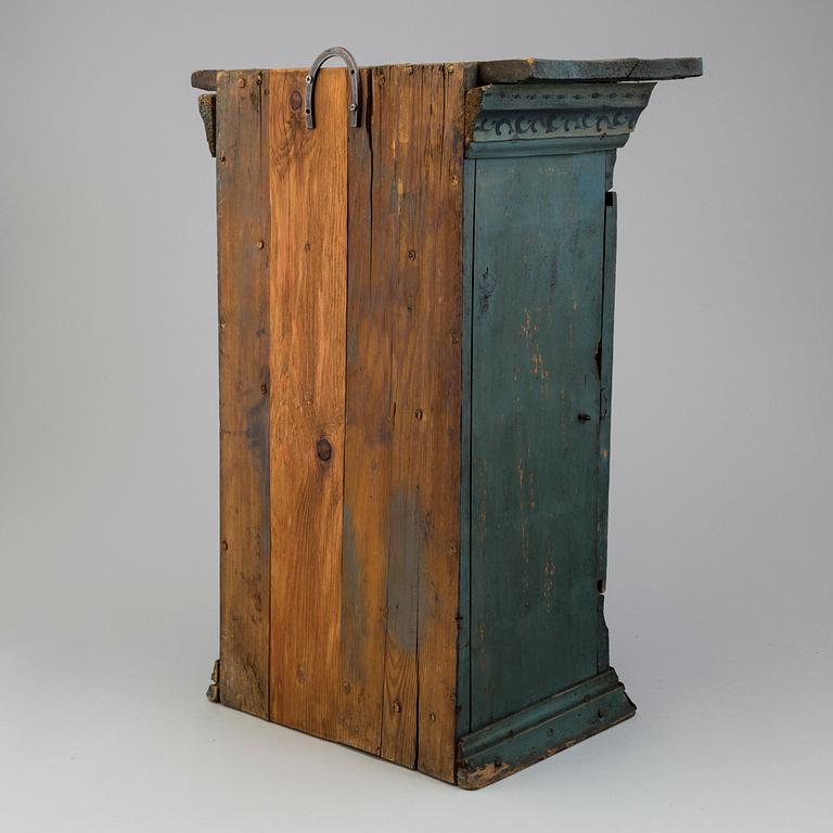a oainted swedish wood wall cabinet, dated 1807.