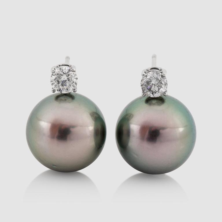 A pair of cultured Tahiti pearl, 14.5 mm, and diamond, 0.95 ct, earrings.