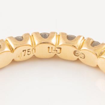 Ring in 18K gold set with round brilliant-cut diamonds, eternity band.