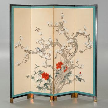 A 20th century folding screen.