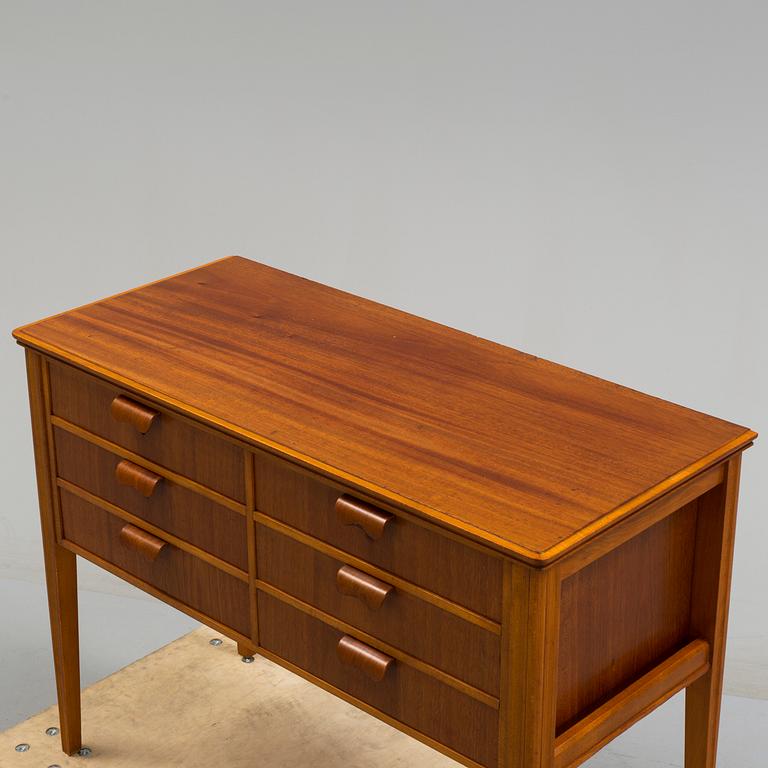 A 1960s teak veneered sideboard.