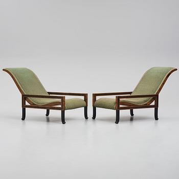 Carl Hörvik, a pair of mahogany-stained birch lounge chairs, Swedish Grace 1920s.