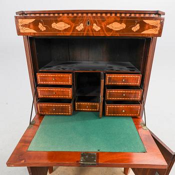 A Louis XV mahogany secretaire around 1800.