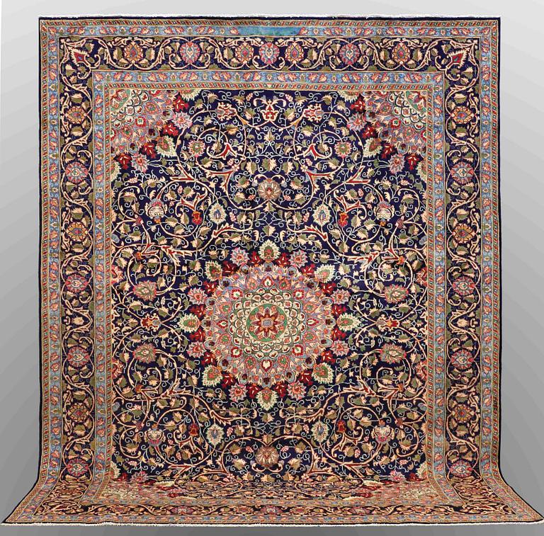 A carpet, Kashmar, signed, ca 390 x 295 cm.