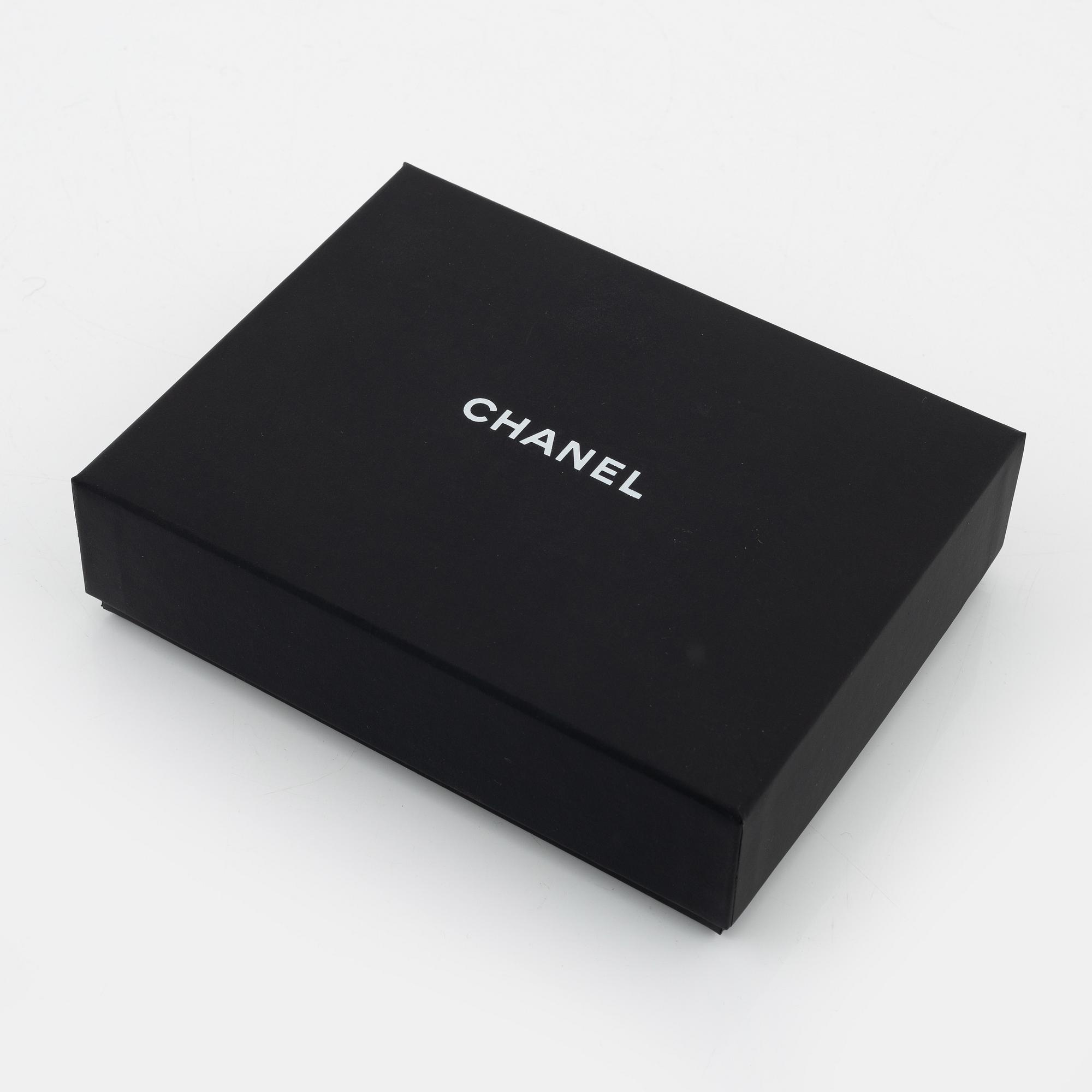 Chanel, a pair of polyurethane and lambskin gloves, size 7.