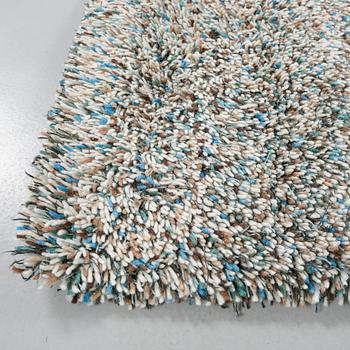 A rug by Gunilla Lagerhem Ullberg, Kasthall, 302 x 123 cm.
