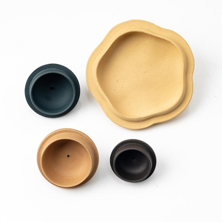 A group of three yixing teapots and a box with cover, China, 1970/80s.