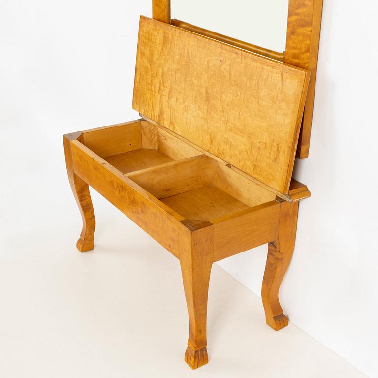 A mirror with console table, early 20th century.