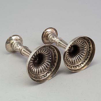 A pair of late 18th century silver candlesticks with unclear hallmarks, possibly from Germany. Weight ca 316 grams.