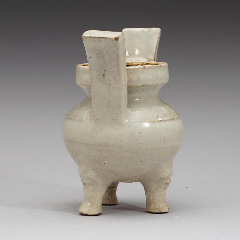 A pale grey-bluish glazed tripod censer with decor in relief, and archaistic mark, Ming dynasty (1368-1644).