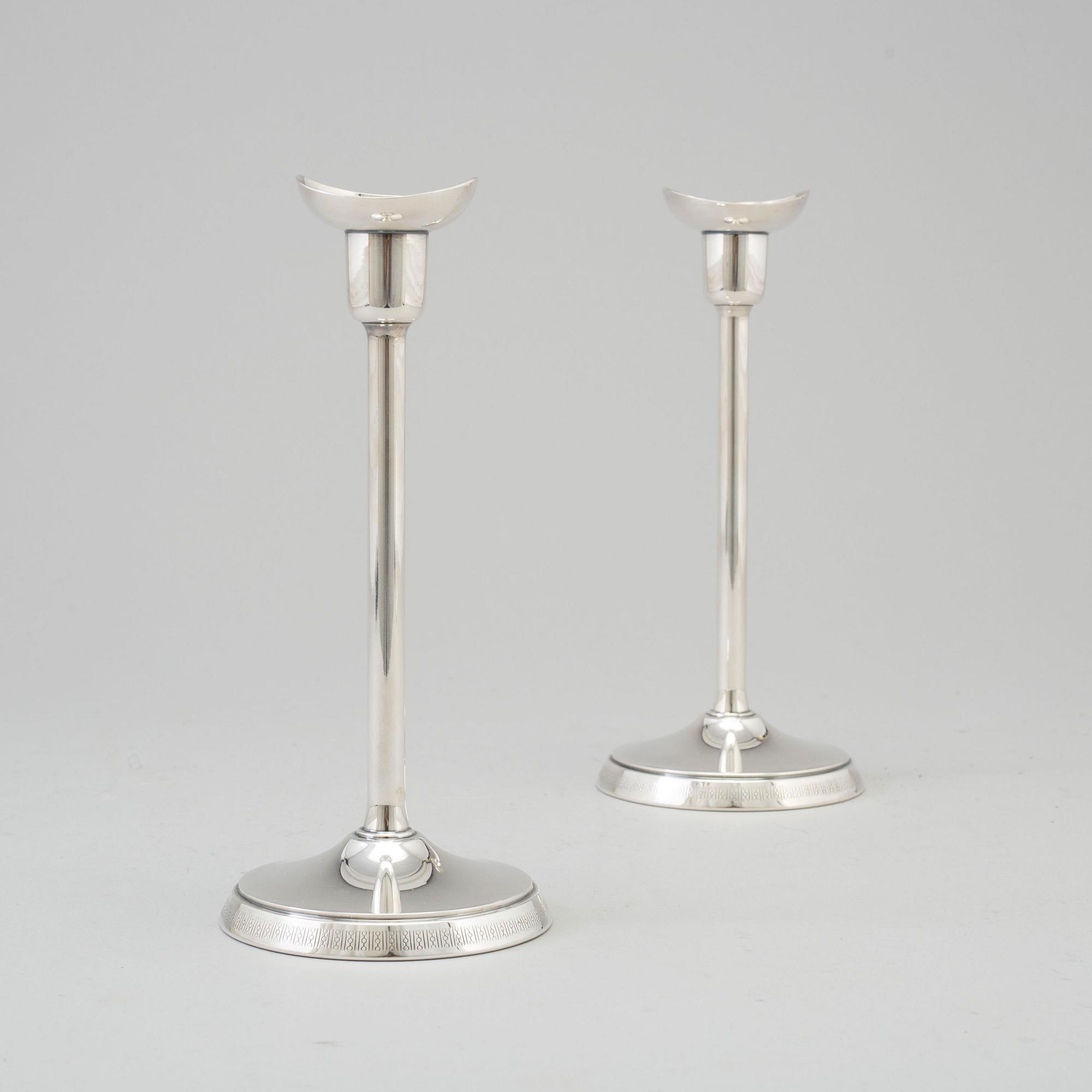 A pair of silver candlesticks by GAB, Stockholm, 1970.