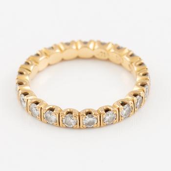 Ring in 18K gold set with round brilliant-cut diamonds, eternity band.