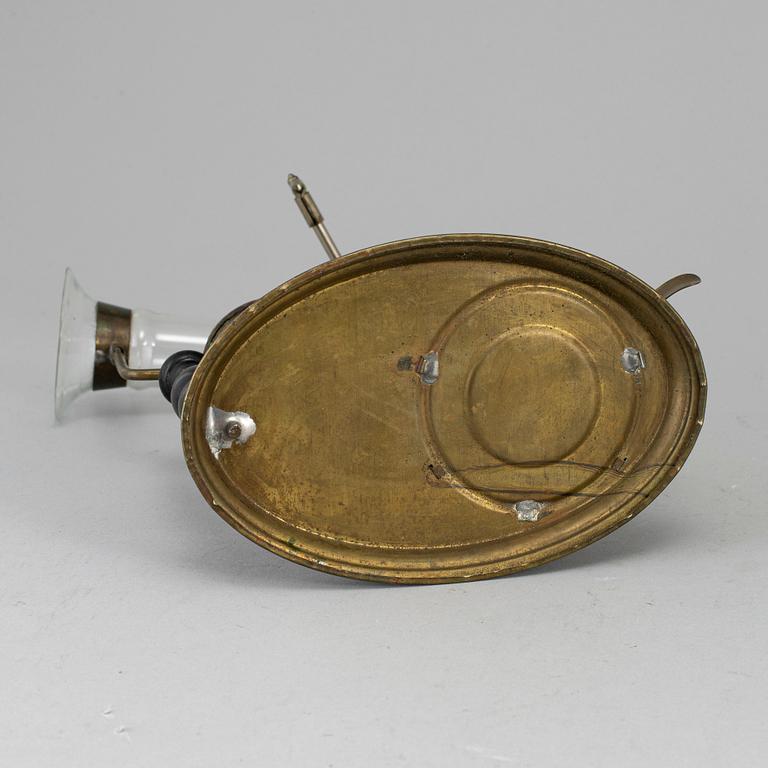 A tinplate burner, 20th century.