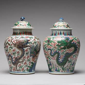 Two Transitional Wucai Baluster vases and covers, 17th Century.