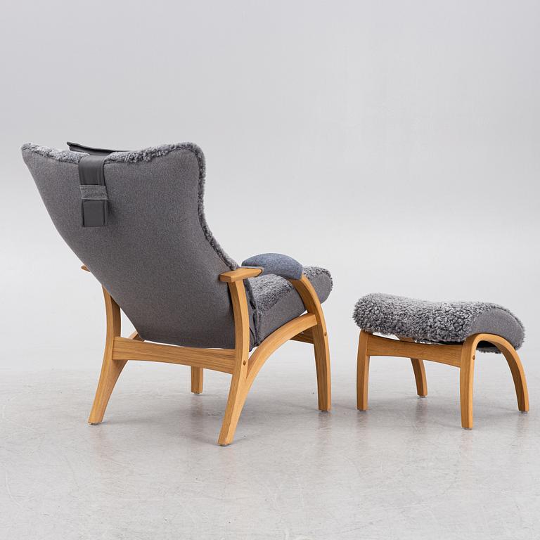 A 'Delta Adventure' armchair with ottoman, Brunstad, Norway.