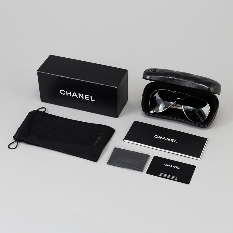 A pair of sunglasses by Chanel.