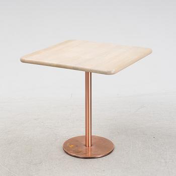 A steel and oak table by Jonas Lindvall 2011.