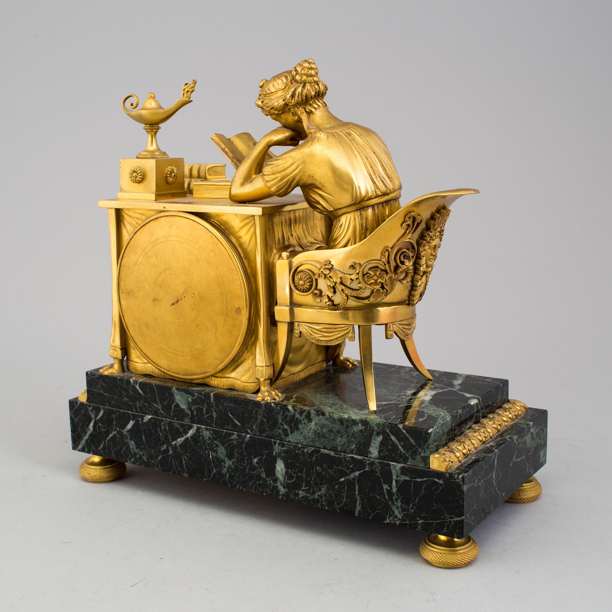 A gilt bronze Empire mantle clock, first half of the 19th Century.