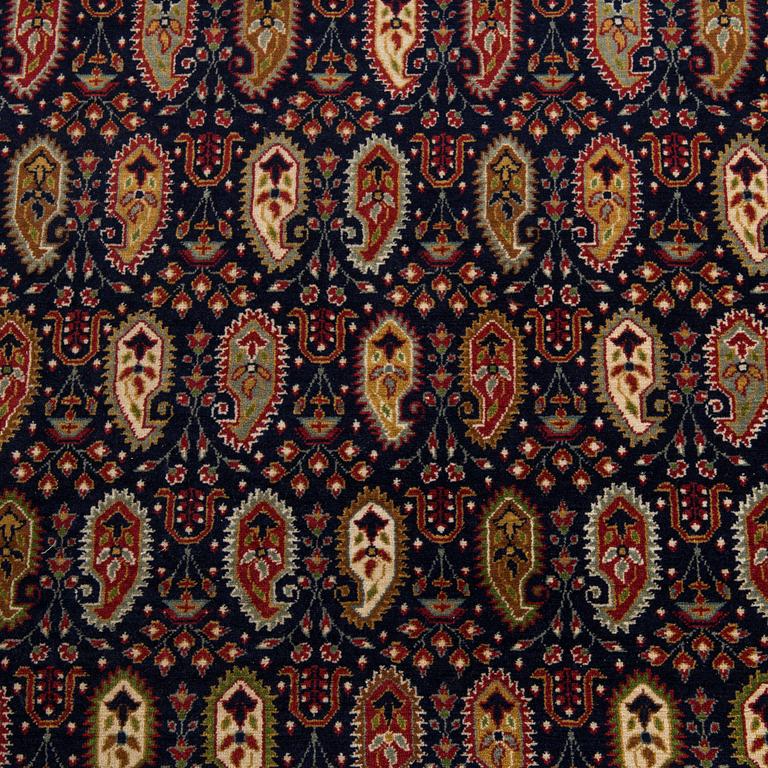 A signed rug, Hereke, Turkey, 184 x 119 cm.