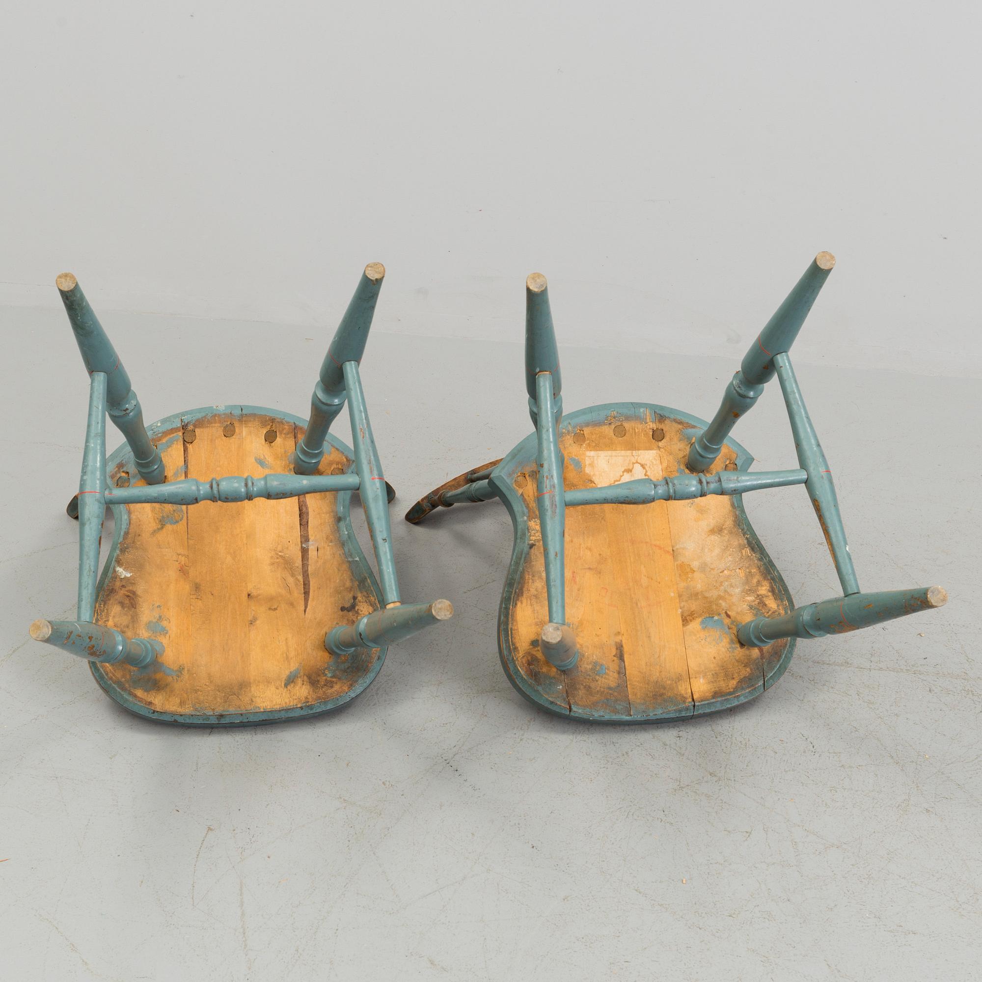 A pair of late 19th century painted chairs.