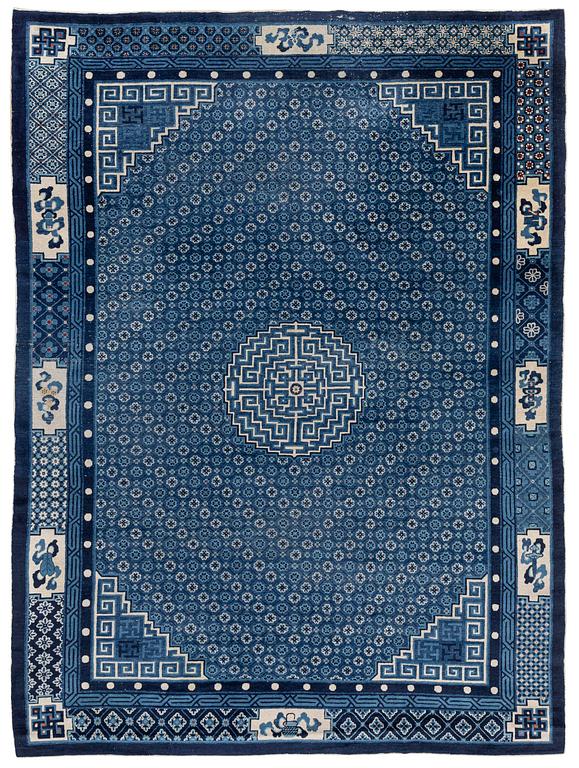 A semi-antique Baotou carpet, West China, c. 335 x 246 cm.