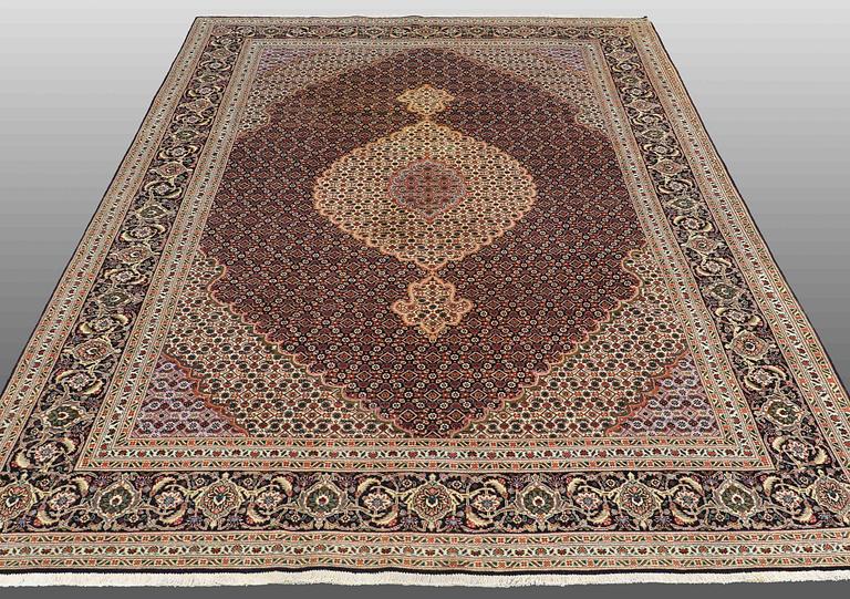 A CARPET, Tabriz part silk , so called 40 Radj, ca 298 x 202 cm.