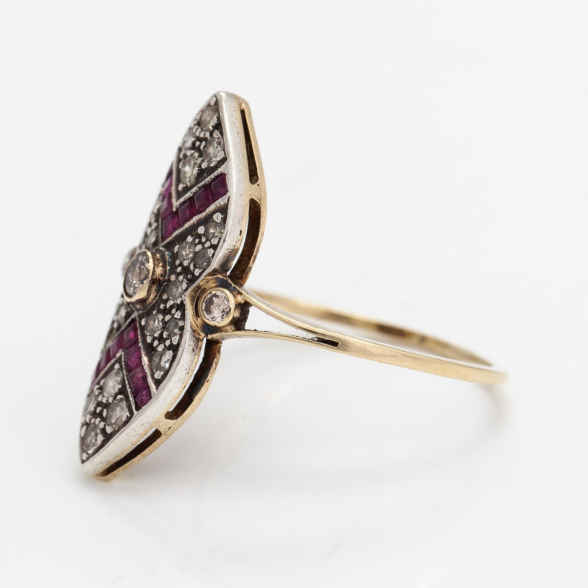 An 18K gold ring, brilliant- and single cut diamonds ca- 0.43 ct in total and rubies.