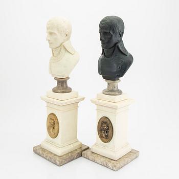 A pair of modern plaster statues of Napoleon.