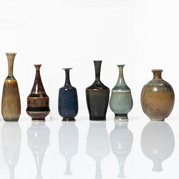 A set of fourteen stoneware vases and ten bowls, predominantly John Andersson, Höganäs.