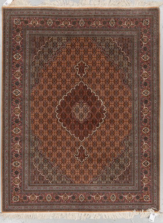 A RUG, Old Tabriz, part silk, ca 201 x 152 cm.