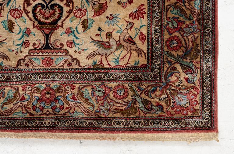 A Qum silk rug, c. 110 x 76 cm.